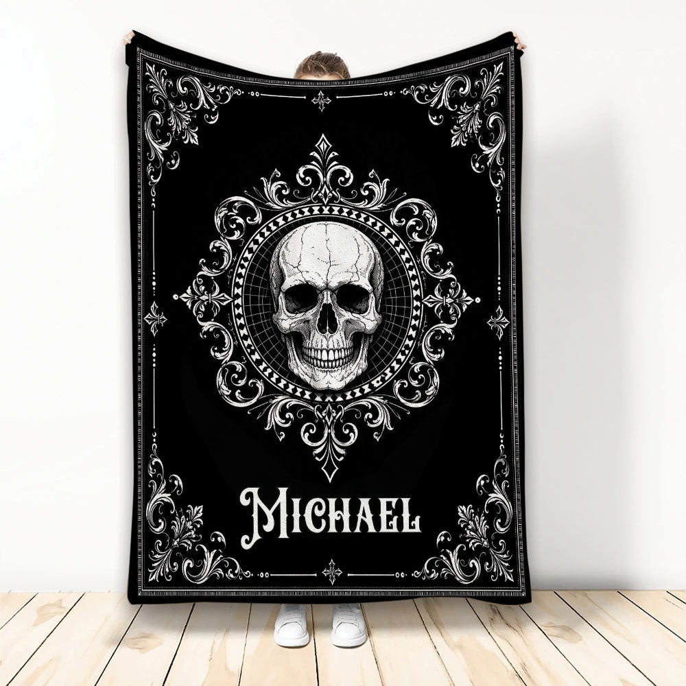 Black and white skull throw blanket with ornate gothic scrollwork shown in a full blanket display