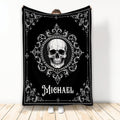 Black and white skull throw blanket with ornate gothic scrollwork shown in a full blanket display