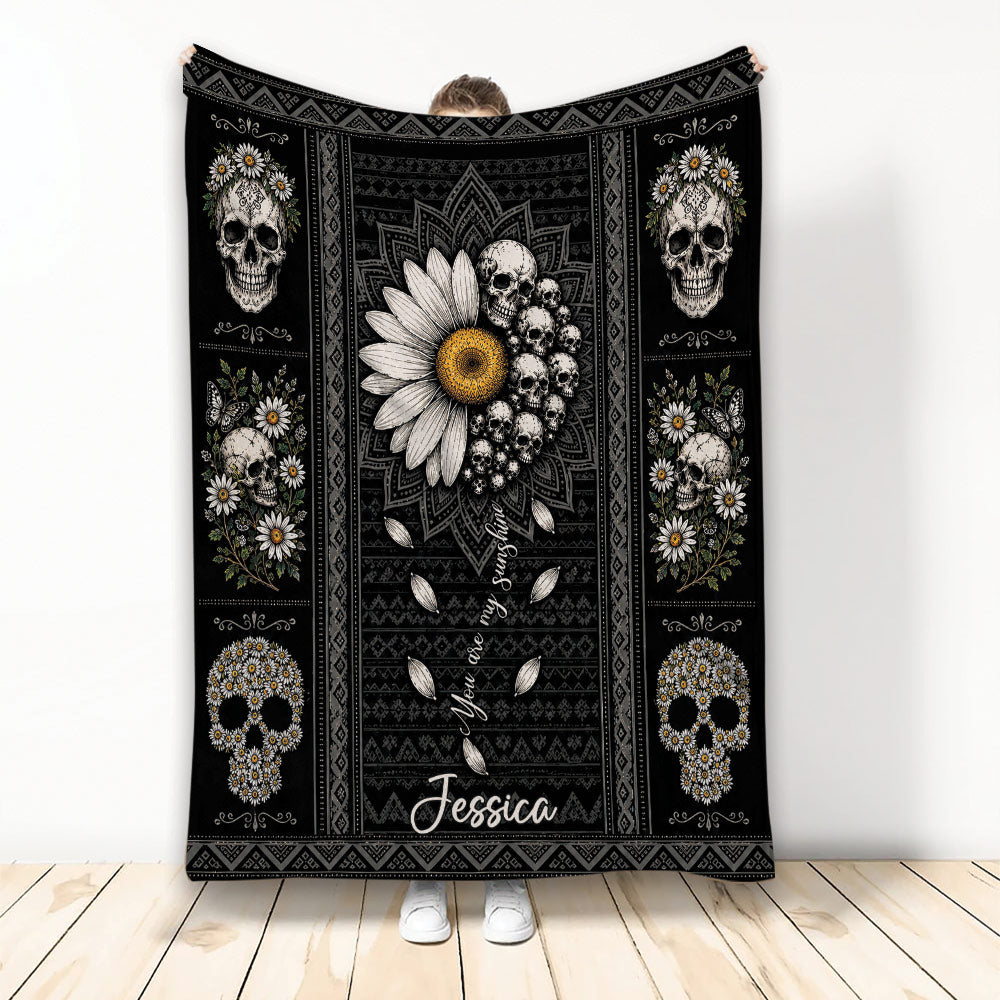 Floral skull throw blanket displayed upright with daisies, sunflowers, and dark decorative patterns