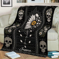 Gothic floral skull throw blanket styled across a sofa with dark ornamental patterns and flowers