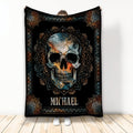 Ornate skull throw blanket with black background, blue and orange artwork, and mandala-inspired border