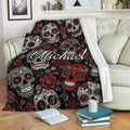 Skull blanket draped over a sofa with red roses, sugar skulls, and dark gothic artwork