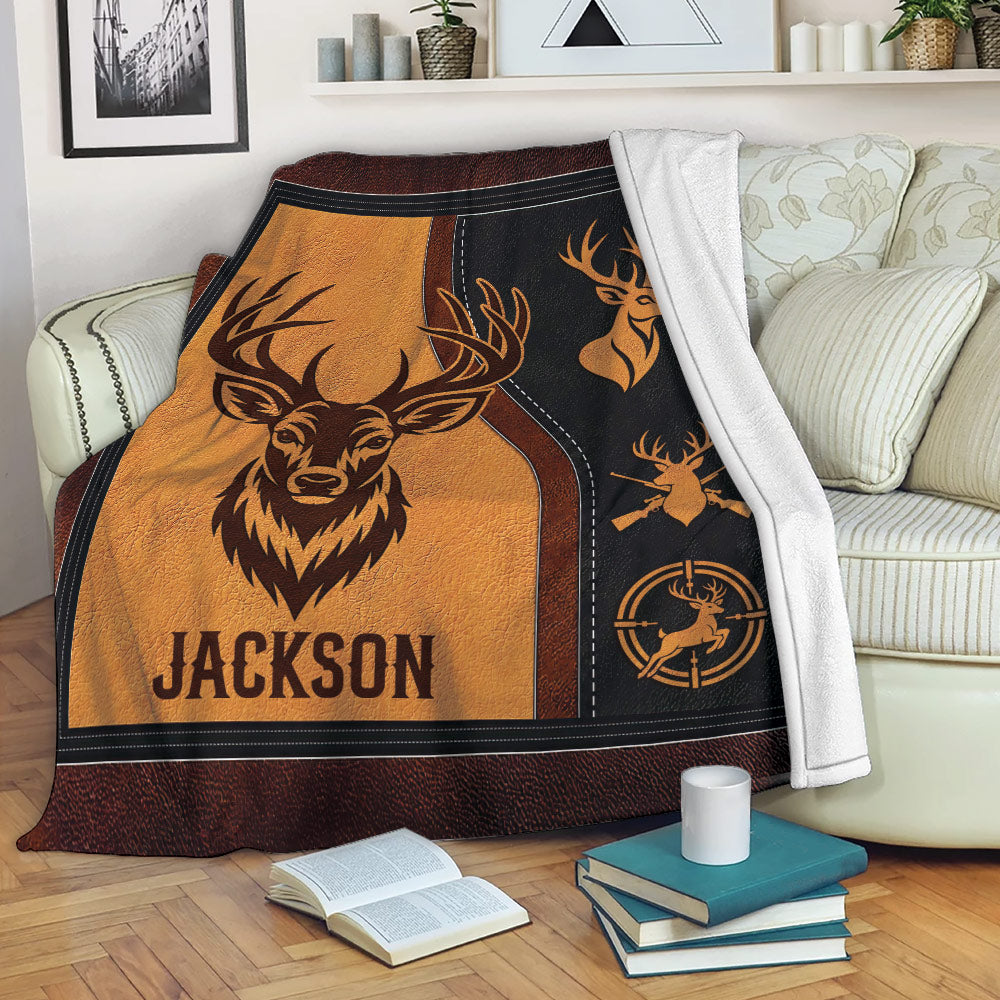 Hunting throw blanket displayed on a sofa with deer artwork and rustic outdoor-inspired colors