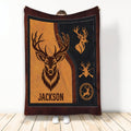 Custom hunting blanket with bold deer artwork, antlers, and rustic orange and black outdoor design