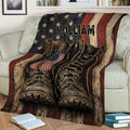 Military service themed throw blanket draped over a sofa with boots, dog tags, and American flag colors