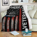 Veteran throw blanket displayed on a sofa with patriotic stars, dog tags, and red, white, and blue design