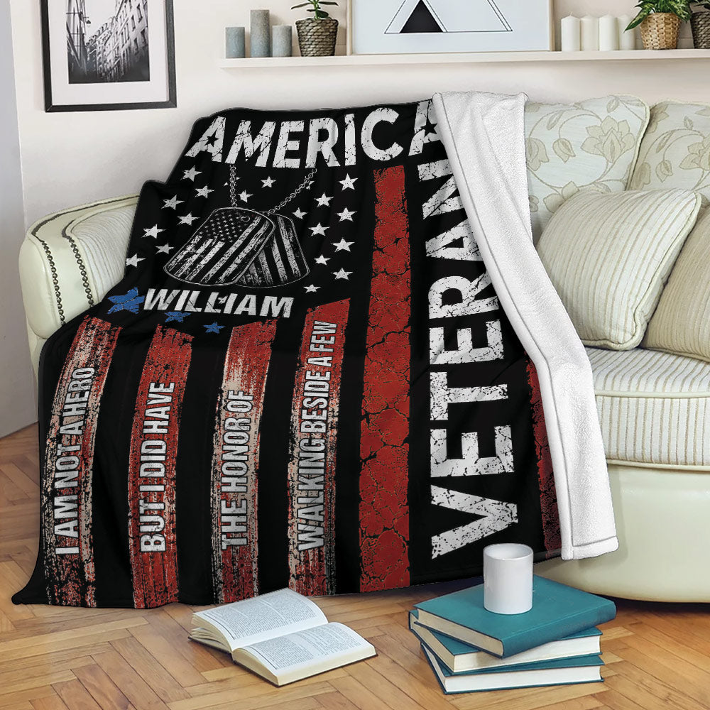 Veteran throw blanket displayed on a sofa with patriotic stars, dog tags, and red, white, and blue design