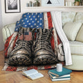 Patriotic veteran throw blanket displayed on a sofa with military boots and American flag design