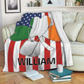 Irish shamrock throw blanket displayed on a sofa with patriotic flag-inspired artwork and silver dog tags