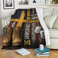 Veteran blanket displayed on a sofa with combat boots, dog tags, and distressed American flag design