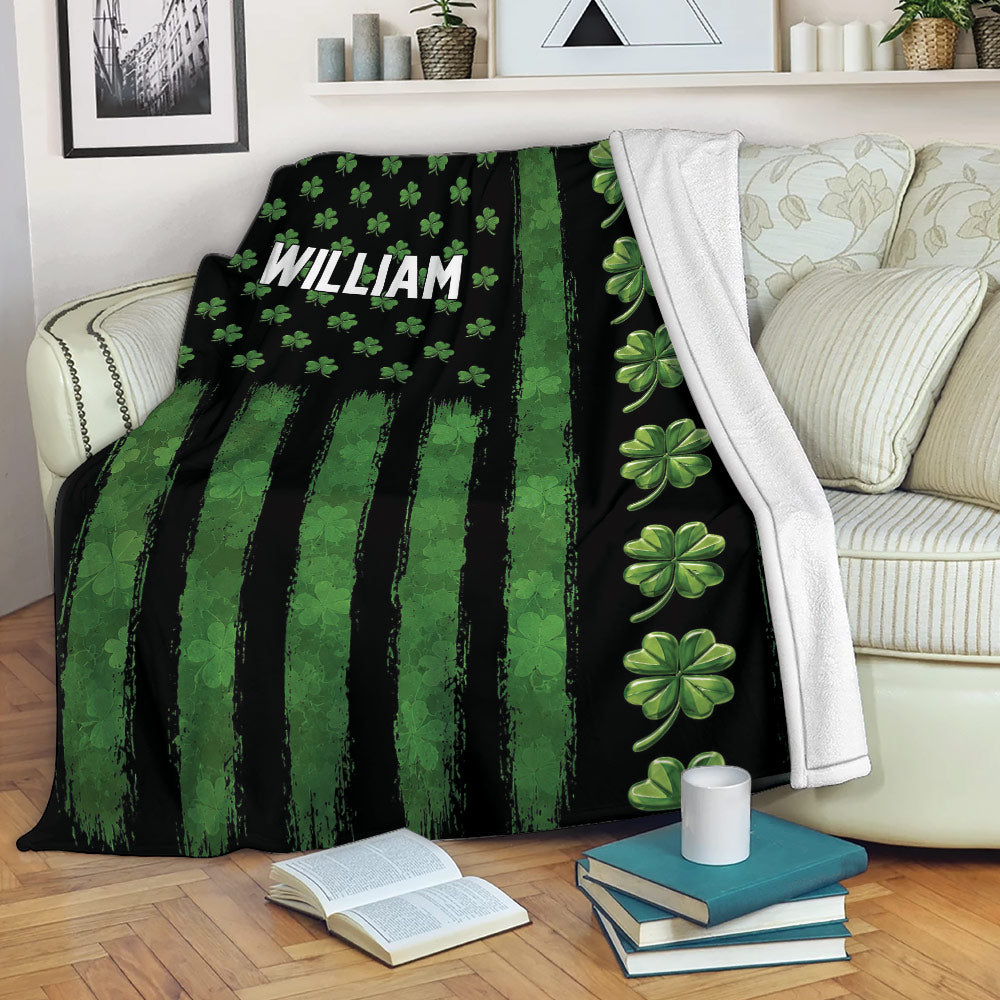 Irish shamrock blanket draped over a sofa with green stripes and clover pattern