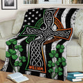 Celtic Irish blanket draped over a sofa with shamrocks and intricate knotwork artwork