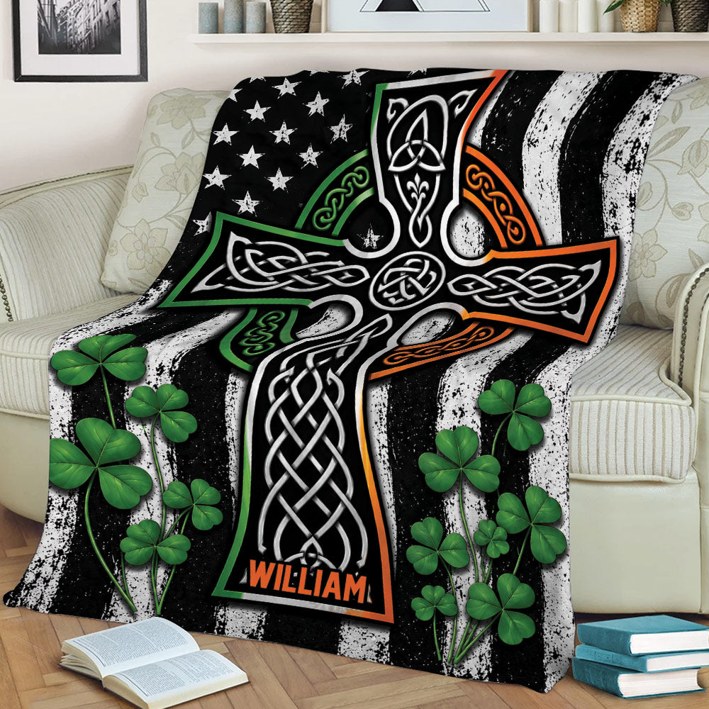 Celtic Irish blanket draped over a sofa with shamrocks and intricate knotwork artwork