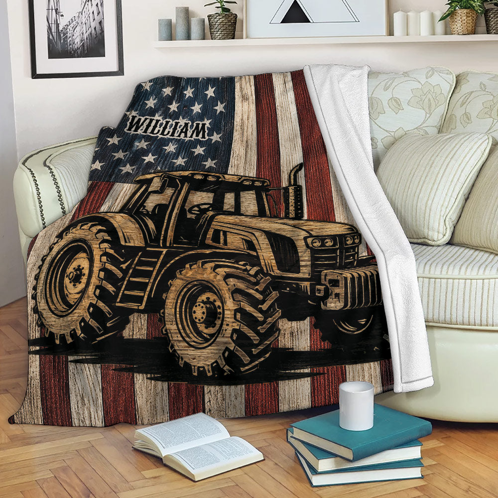Rustic tractor blanket draped over a sofa, featuring patriotic stars and stripes artwork