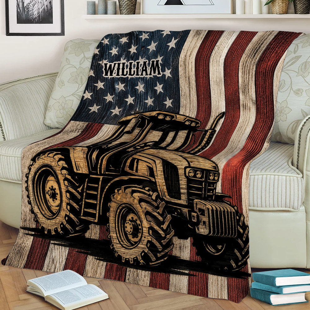 Patriotic tractor throw blanket displayed on a sofa with rustic woodgrain styling
