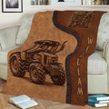 Close lifestyle view of a brown tractor throw blanket covering a sofa