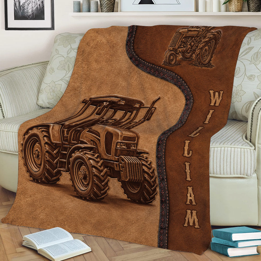 Close lifestyle view of a brown tractor throw blanket covering a sofa