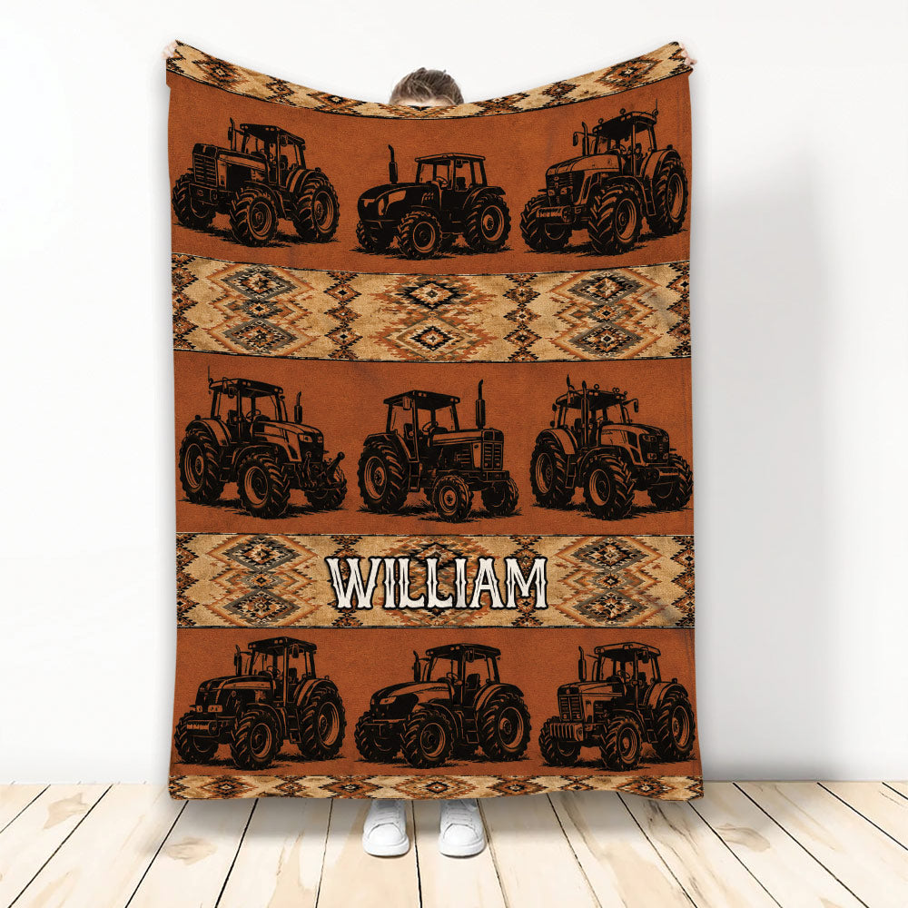 Tractor throw blanket displayed vertically with repeated farm tractor artwork and rustic geometric patterns