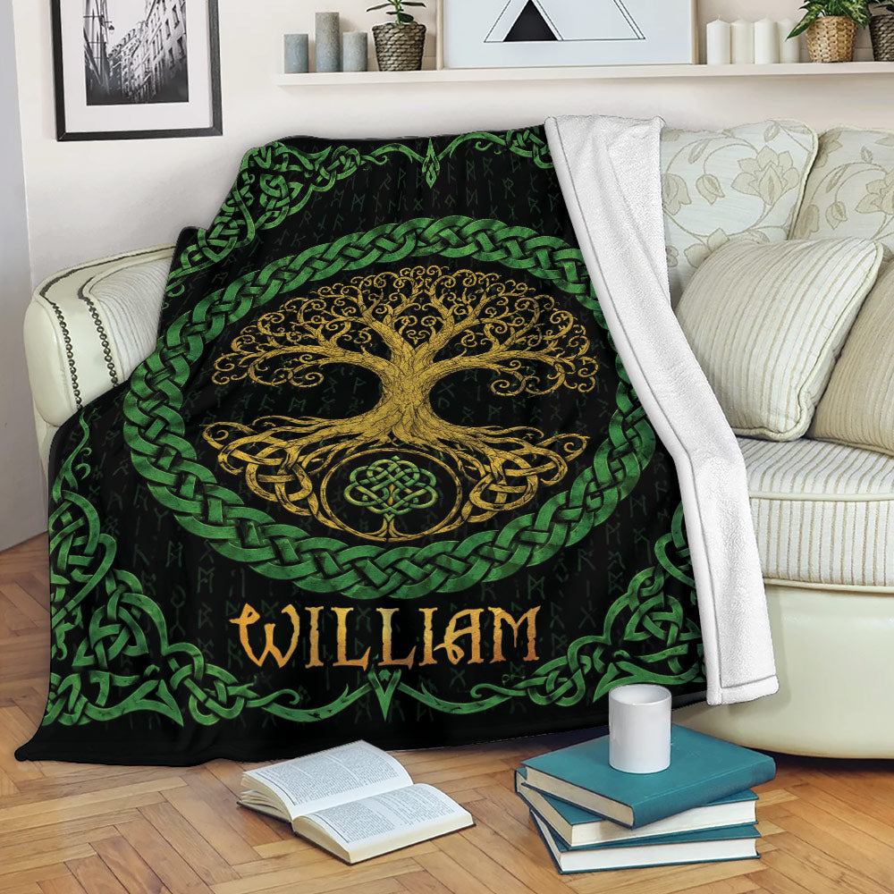 Tree Of Life throw blanket draped across a sofa with golden and green Celtic artwork