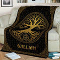 Tree of Life blanket displayed on a sofa with gold knotwork and black artwork