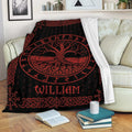 Tree of Life throw blanket displayed on a sofa with black and red rune and knotwork artwork