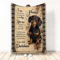 Dachshund throw blanket with black and tan dog artwork and an ornate vintage-inspired border