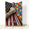 Autism throw blanket with colorful puzzle pieces, awareness artwork, and a bold red, black, and white design