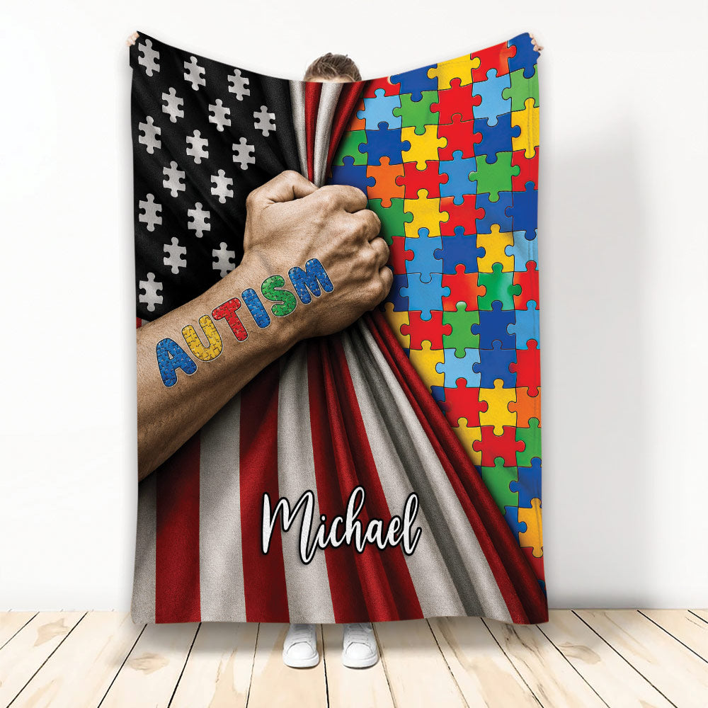 Autism throw blanket with colorful puzzle pieces, awareness artwork, and a bold red, black, and white design