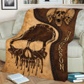 Close lifestyle view of a distressed Skull Throw Blanket with layered skull graphics