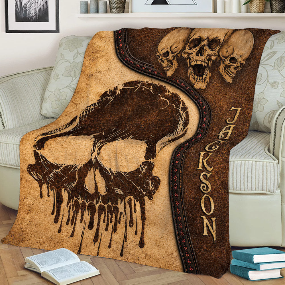 Close lifestyle view of a distressed Skull Throw Blanket with layered skull graphics
