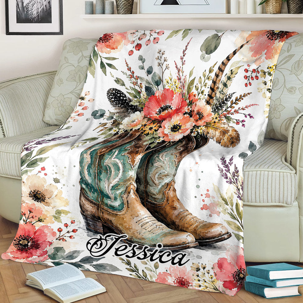Western cowboy blanket displaying ornate boots and colorful flowers on a cozy sofa