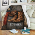 Cowboy throw blanket draped over a sofa with Western hat and boot artwork in a rustic living room