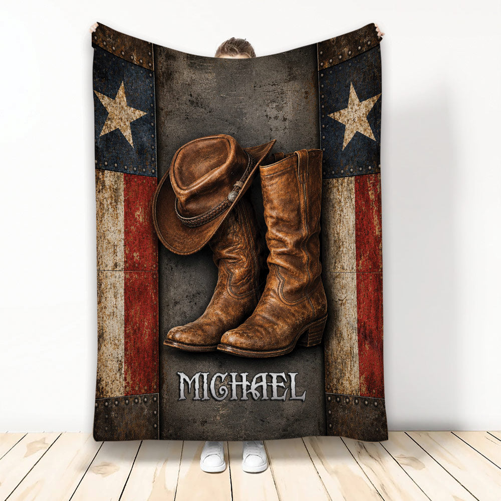 Rustic cowboy blanket displayed with a leather hat, Western boots, star panels, and distressed patriotic artwork