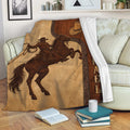 Rustic cowboy and horse throw blanket draped over a living room sofa