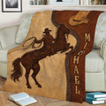Western cowboy horse artwork displayed on a cozy sofa throw blanket
