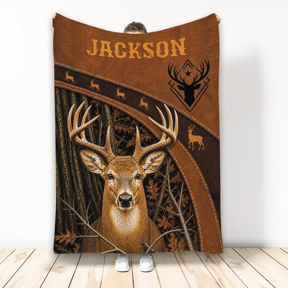 Hunting throw blanket featuring a detailed buck in a forest scene with rustic brown stitched-look artwork
