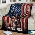 Close view of a buck hunting blanket draped over a sofa with rustic American flag artwork
