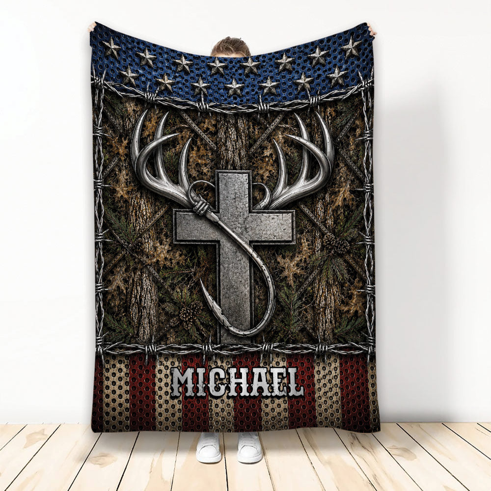 Fishing blanket featuring a large metallic hook, antlers, woodland camouflage, stars, and rugged outdoor artwork