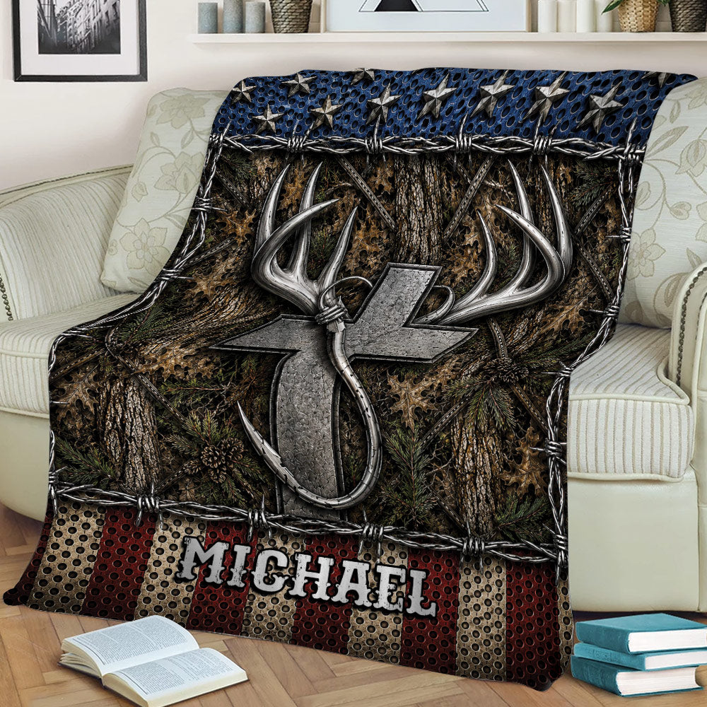 Rustic fishing blanket draped over a sofa with hook and antler artwork, woodland textures, and bold blue accents