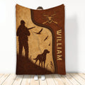 Rustic hunting throw blanket featuring a hunter, hunting dog, deer emblem, birds, and warm leather-inspired artwork