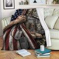 Patriotic veteran blanket draped over a sofa with military uniform, boots, helmet, and dog tags