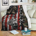 Patriotic veteran blanket displayed on a sofa with military boots, dog tags, camouflage, and flag artwork