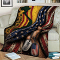 Close view of a veteran throw blanket featuring layered American flags, dog tags, and distressed patriotic artwork