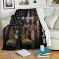 Patriotic veteran blanket draped over a sofa with combat boots, dog tags, flags, and military tribute artwork