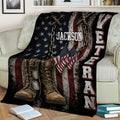 Veteran throw blanket displayed on a couch with combat boots, flags, chains, and bold distressed military artwork