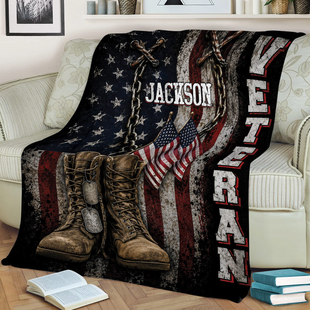Veteran throw blanket displayed on a couch with combat boots, flags, chains, and bold distressed military artwork
