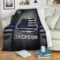 Police throw blanket displayed on a sofa with shield emblem and thin blue line artwork