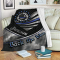 Police throw blanket displayed on a sofa with patriotic sunflower artwork and thin blue line symbolism