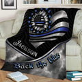 Law enforcement throw blanket styled on a couch with a patriotic sunflower and bold blue and silver design