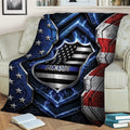 Patriotic police throw blanket displayed on a sofa with shield artwork, stars, and blue line details